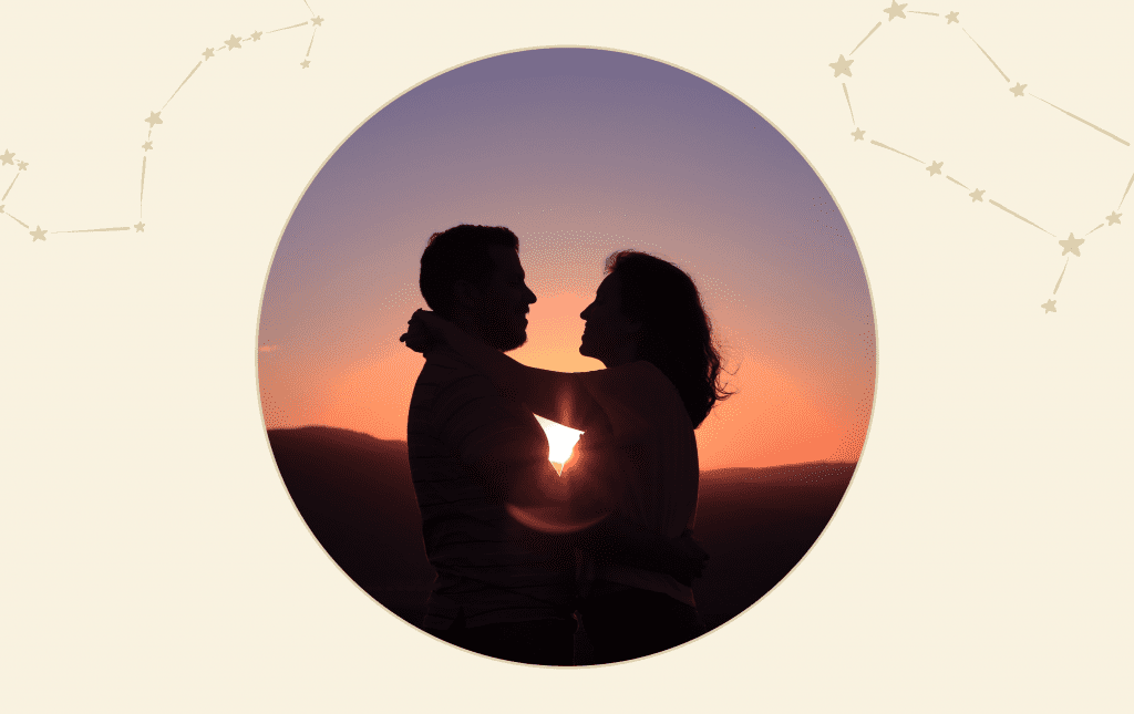 The silhouettes of a man and a woman hugging face to face with a sunset background