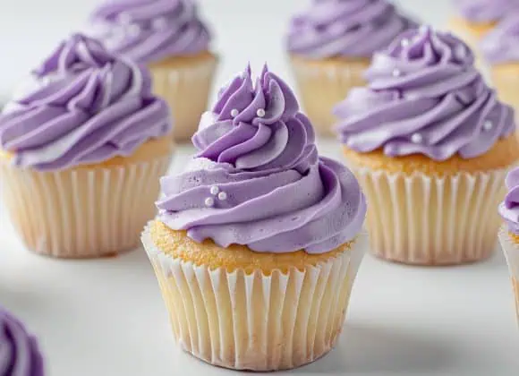 milkychoco04_A_group_of_lavender_frosted_cupcakes_with_delicate_84610353-c3bd-41f0-91c0-83970e9c7753