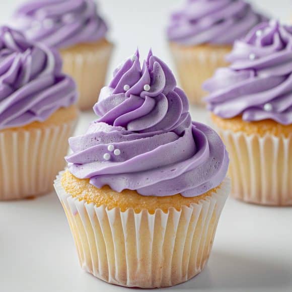 milkychoco04_A_group_of_lavender_frosted_cupcakes_with_delicate_84610353-c3bd-41f0-91c0-83970e9c7753